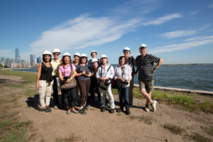 Group photo taken after the hard hat tour on Ellis Island.