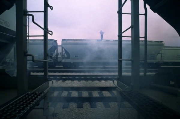 man on the train car in the fog