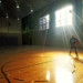 man standing with basketball in gym thumbnail