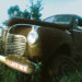 old car in the grass thumbnail