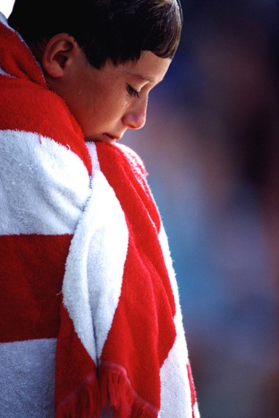 boyswimmingwithredandwhitetowel