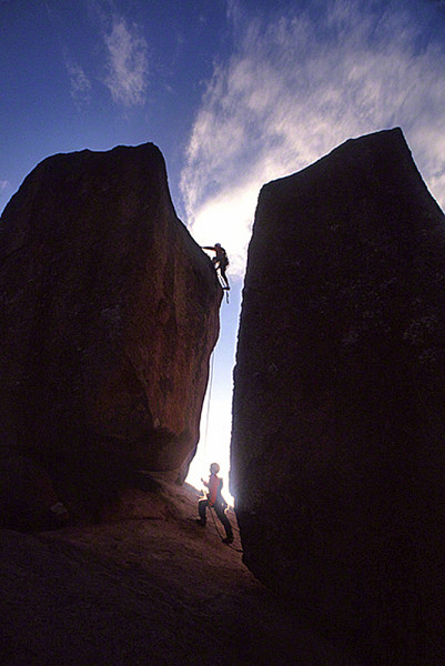 2 men climbing up rockDM