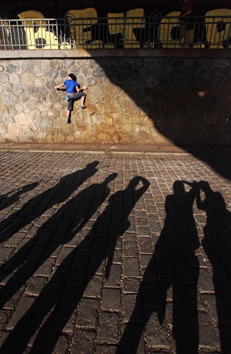 Shadows that are the center of interest and provide visual direction.