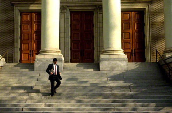 businessmanwalkingdowncourthousesteps1-600x394_DM