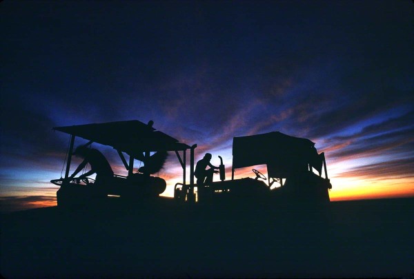 twomenwithequipmentatsunrise