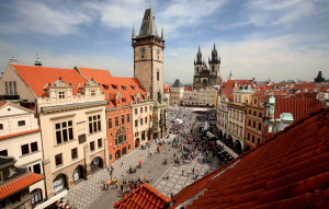 Enjoying the view of the Old town Square with a glass of wine.