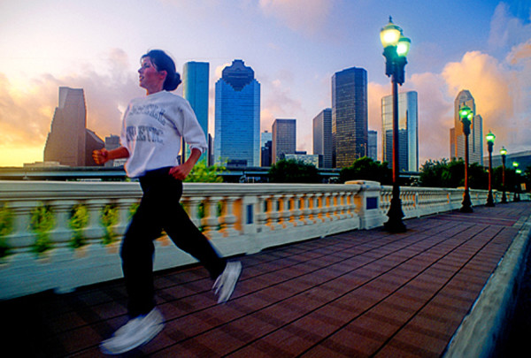 woman running on bridge