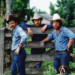 3cowboysstandingbyafence0203 thumbnail