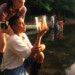 students-looking-into-beaker-at-lake-20932 thumbnail